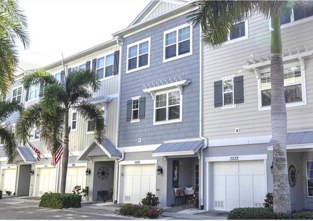 multi unit property featuring an attached garage