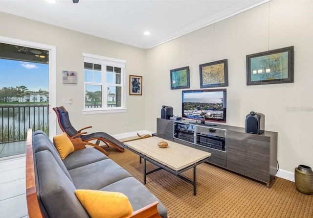 living area with recessed lighting and baseboards