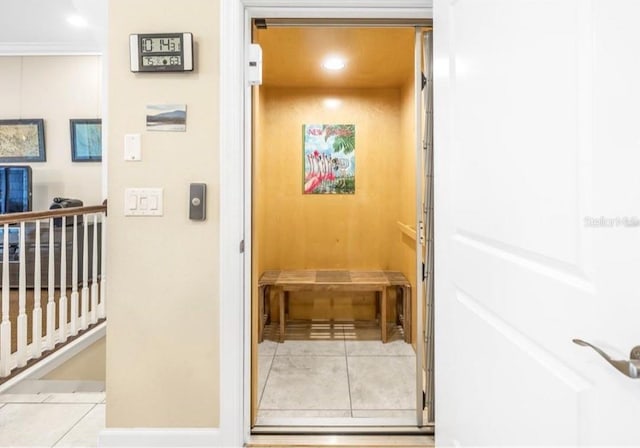 hallway with recessed lighting, a sauna, and light tile patterned floors