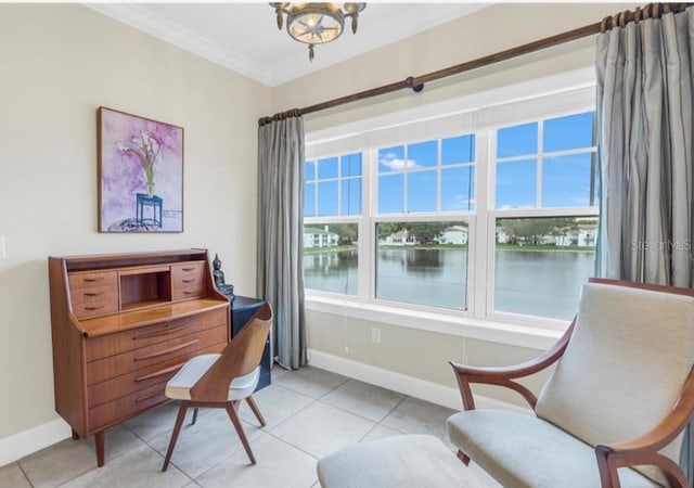 living area with a water view, ornamental molding, and a wealth of natural light