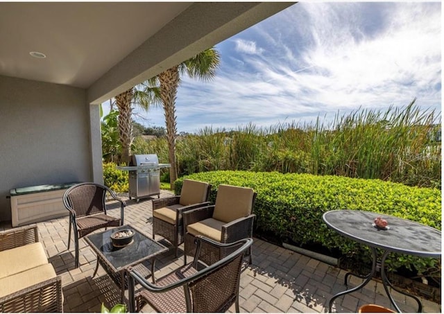 view of patio / terrace featuring an outdoor living space and area for grilling