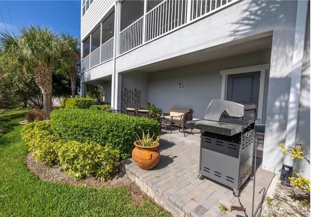 view of patio with a balcony and grilling area