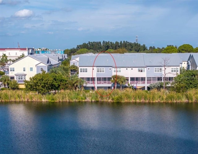 bird's eye view with a water view and a residential view