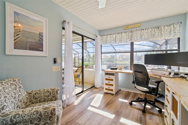 home office featuring wood ceiling and light hardwood / wood-style floors