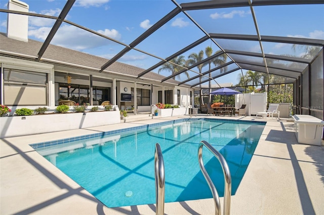 view of pool featuring a lanai and a patio