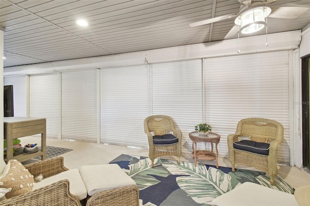 sunroom / solarium featuring ceiling fan