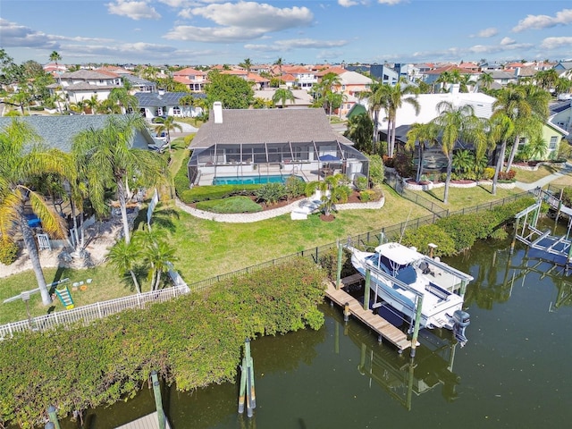 bird's eye view with a water view and a residential view