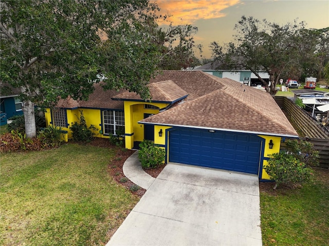 single story home featuring a yard