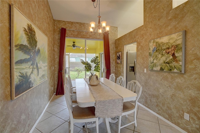 tiled dining area featuring an inviting chandelier