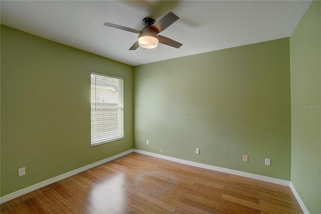 empty room featuring ceiling fan and light wood-type flooring