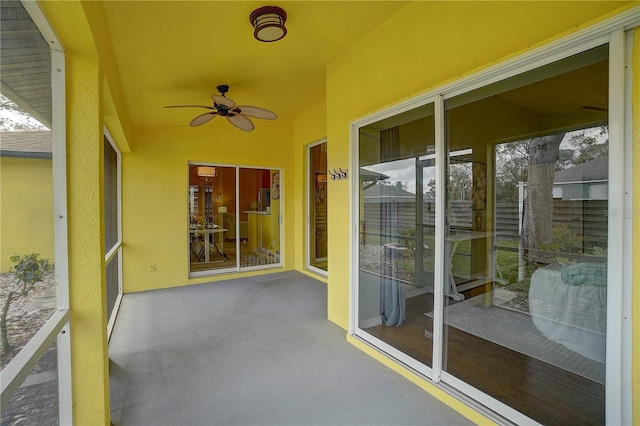 unfurnished sunroom featuring ceiling fan and lofted ceiling