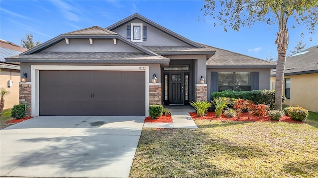 view of front of house with a garage and a front lawn