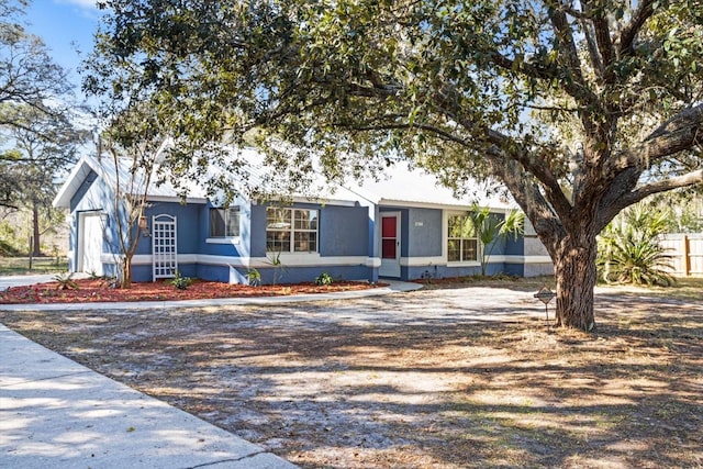 single story home featuring a garage