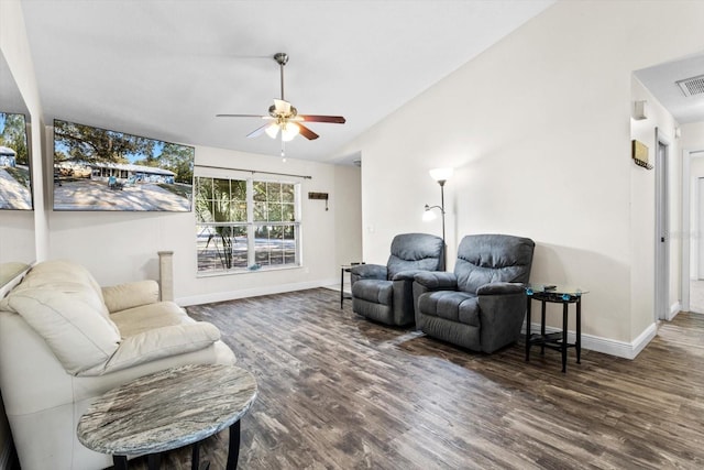 living room with vaulted ceiling, dark hardwood / wood-style floors, and ceiling fan