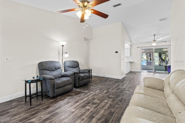 living room featuring dark hardwood / wood-style flooring and vaulted ceiling