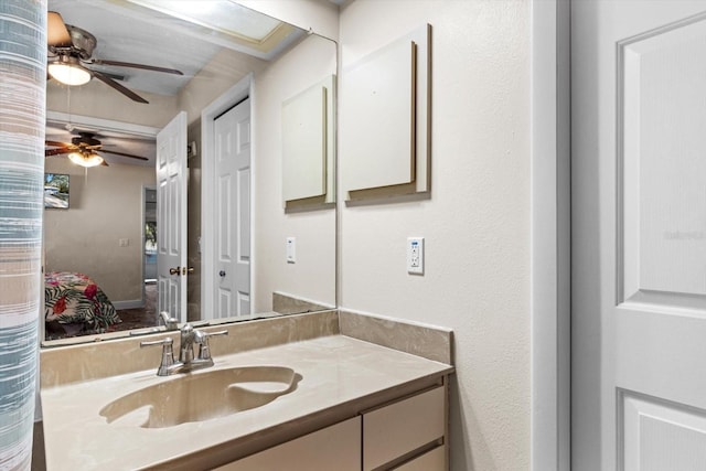 bathroom featuring vanity and ceiling fan