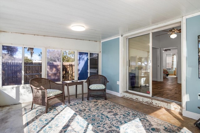 sunroom with ceiling fan