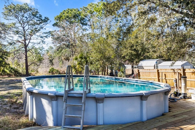 view of swimming pool featuring a wooden deck