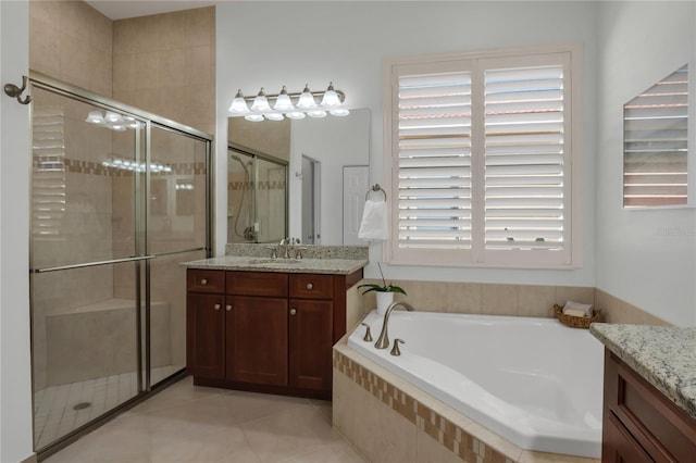 bathroom featuring vanity, tile patterned flooring, and independent shower and bath