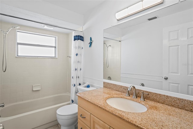 full bathroom with vanity, toilet, and shower / bath combo with shower curtain