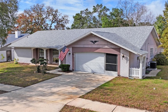 ranch-style house featuring cooling unit, a garage, covered porch, and a front lawn