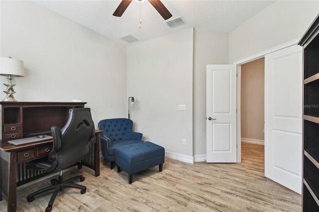 home office with ceiling fan, wood finished floors, visible vents, and baseboards