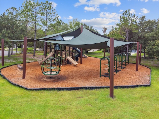 community playground featuring a lawn