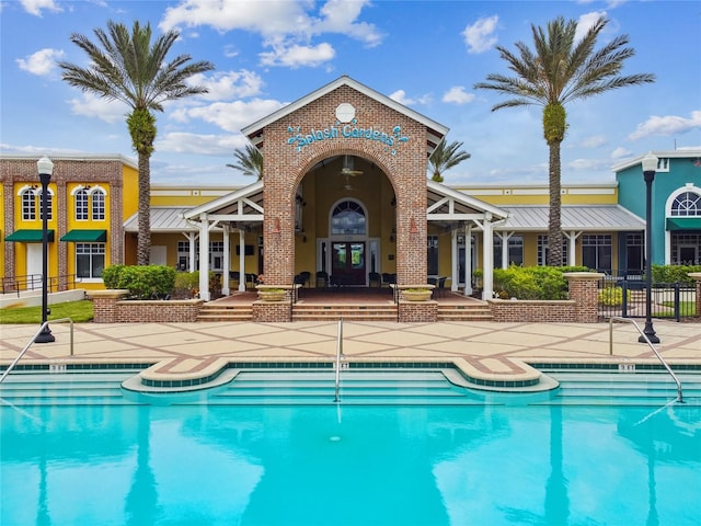 pool with french doors, a patio, and fence