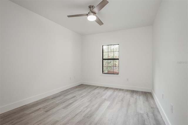 spare room featuring light hardwood / wood-style floors and ceiling fan