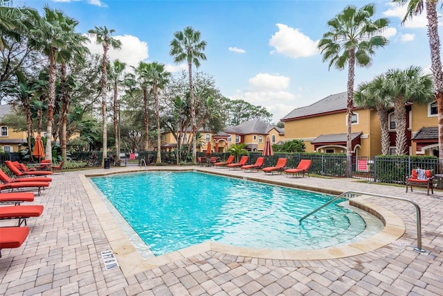 view of swimming pool with a patio