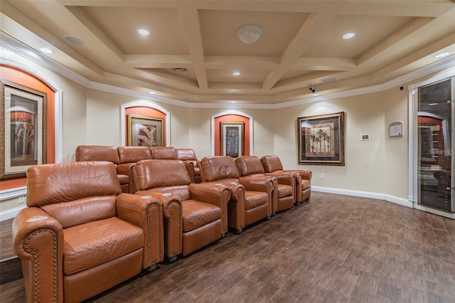 cinema room with coffered ceiling, dark hardwood / wood-style floors, beam ceiling, and crown molding