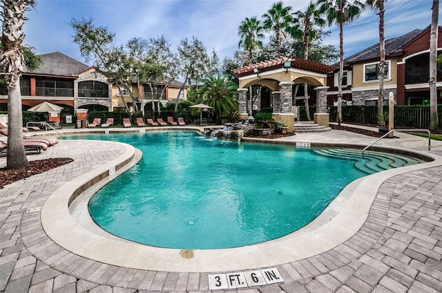 view of swimming pool featuring a patio and pool water feature