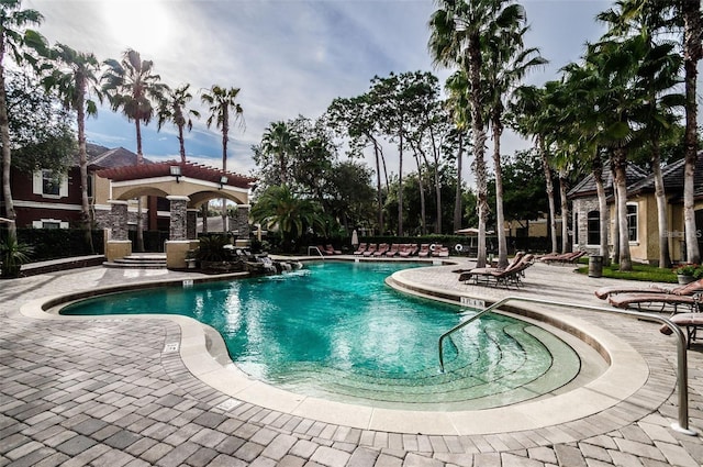 view of swimming pool featuring a patio and pool water feature