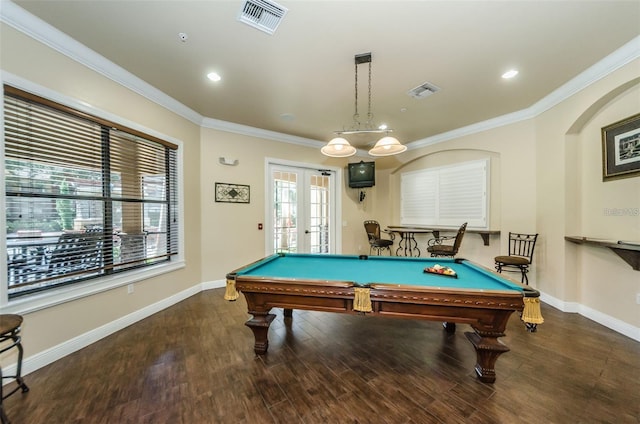 recreation room featuring pool table, dark wood-type flooring, ornamental molding, and french doors