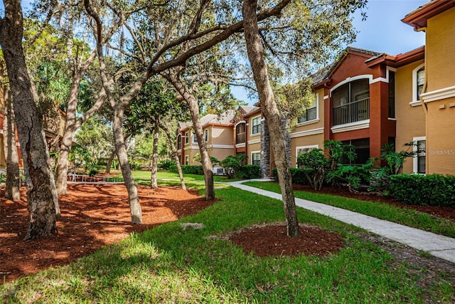 view of home's community featuring a yard