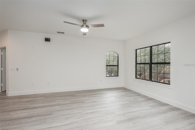 unfurnished room with ceiling fan and light hardwood / wood-style flooring