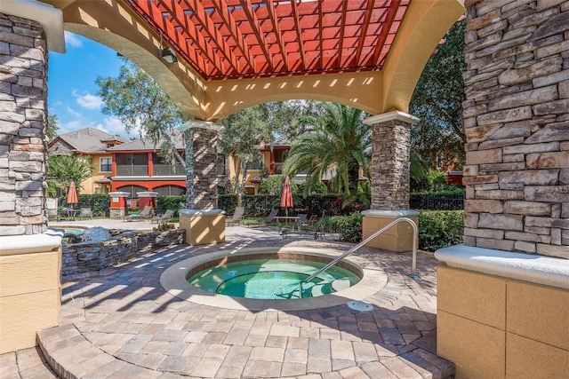 view of swimming pool featuring a patio area and a community hot tub