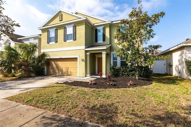 view of front of property featuring a garage and a front yard