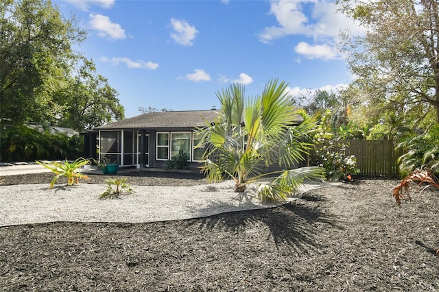 rear view of house with a sunroom