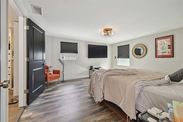 bedroom featuring dark hardwood / wood-style floors