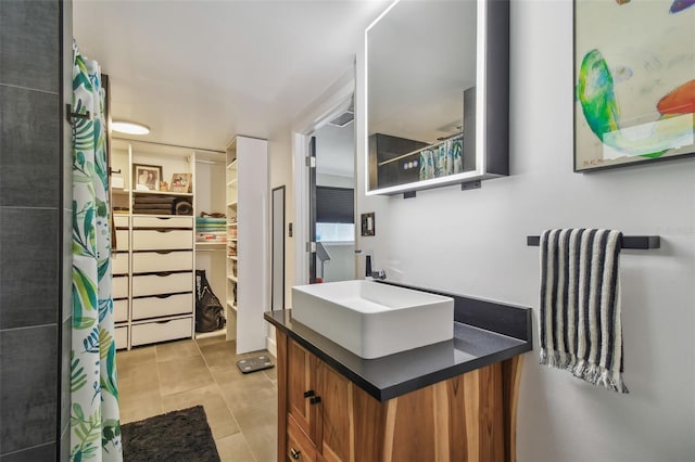 bathroom with tile patterned floors and vanity