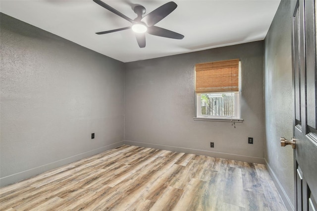 spare room with ceiling fan and light hardwood / wood-style floors