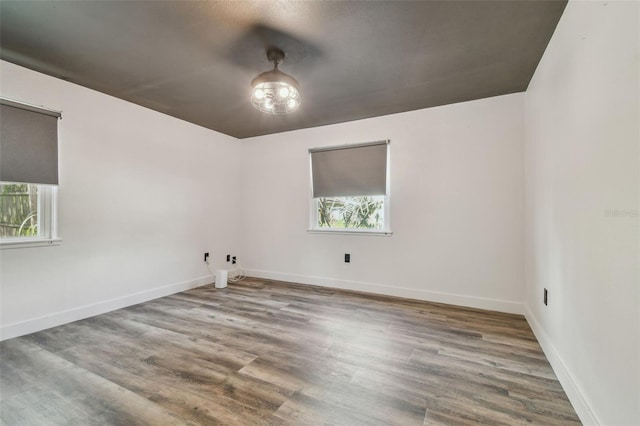 spare room with hardwood / wood-style flooring