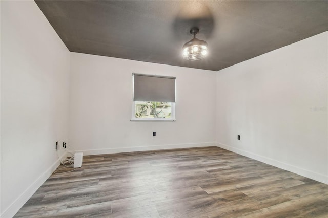 spare room featuring hardwood / wood-style floors