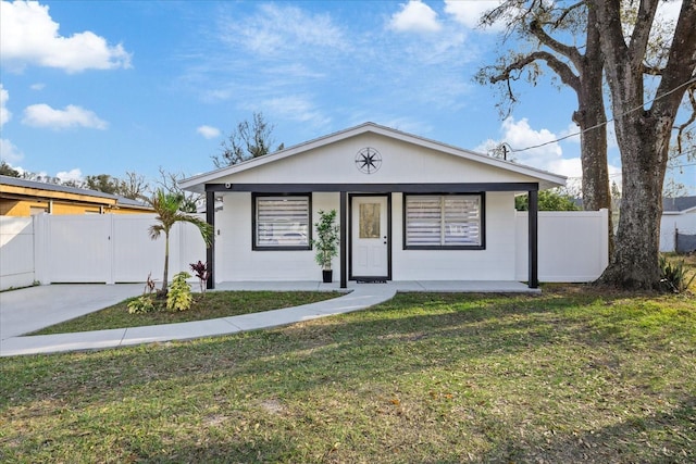 single story home featuring a front yard and a porch