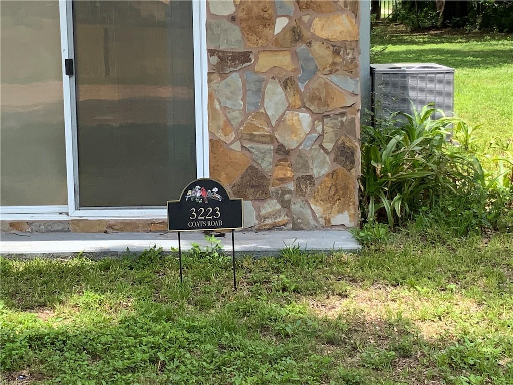 3223 Coats Rd, Zephyrhills, FL 33541 - exterior view of a central air condition unit