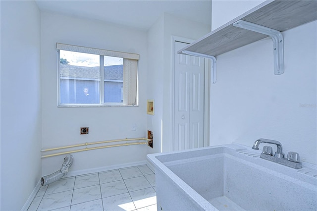 18126 Kara Ct, Tampa, FL 33647 - bathroom with a sink, marble finish flooring, and baseboards
