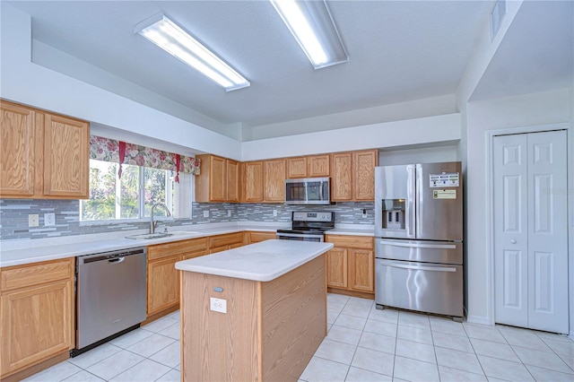 18126 Kara Ct, Tampa, FL 33647 - kitchen with appliances with stainless steel finishes, a sink, light countertops, light tile patterned flooring, and backsplash