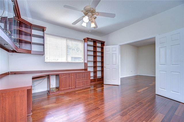 18126 Kara Ct, Tampa, FL 33647 - unfurnished office with built in desk, wood finished floors, a ceiling fan, and baseboards