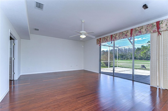 18126 Kara Ct, Tampa, FL 33647 - empty room with ceiling fan, dark wood-style flooring, and baseboards